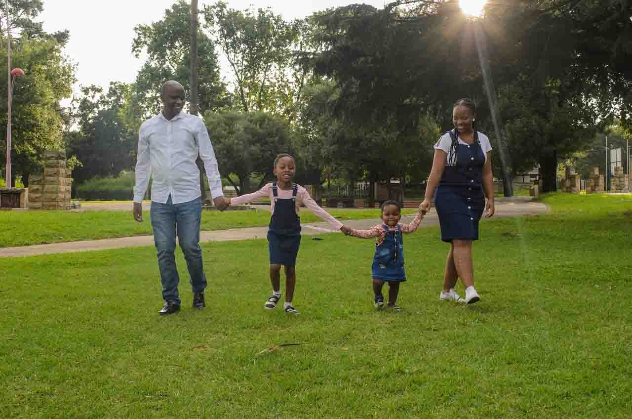 a family walking together in a park