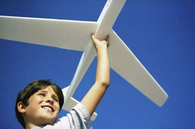 child playing with a toy plane