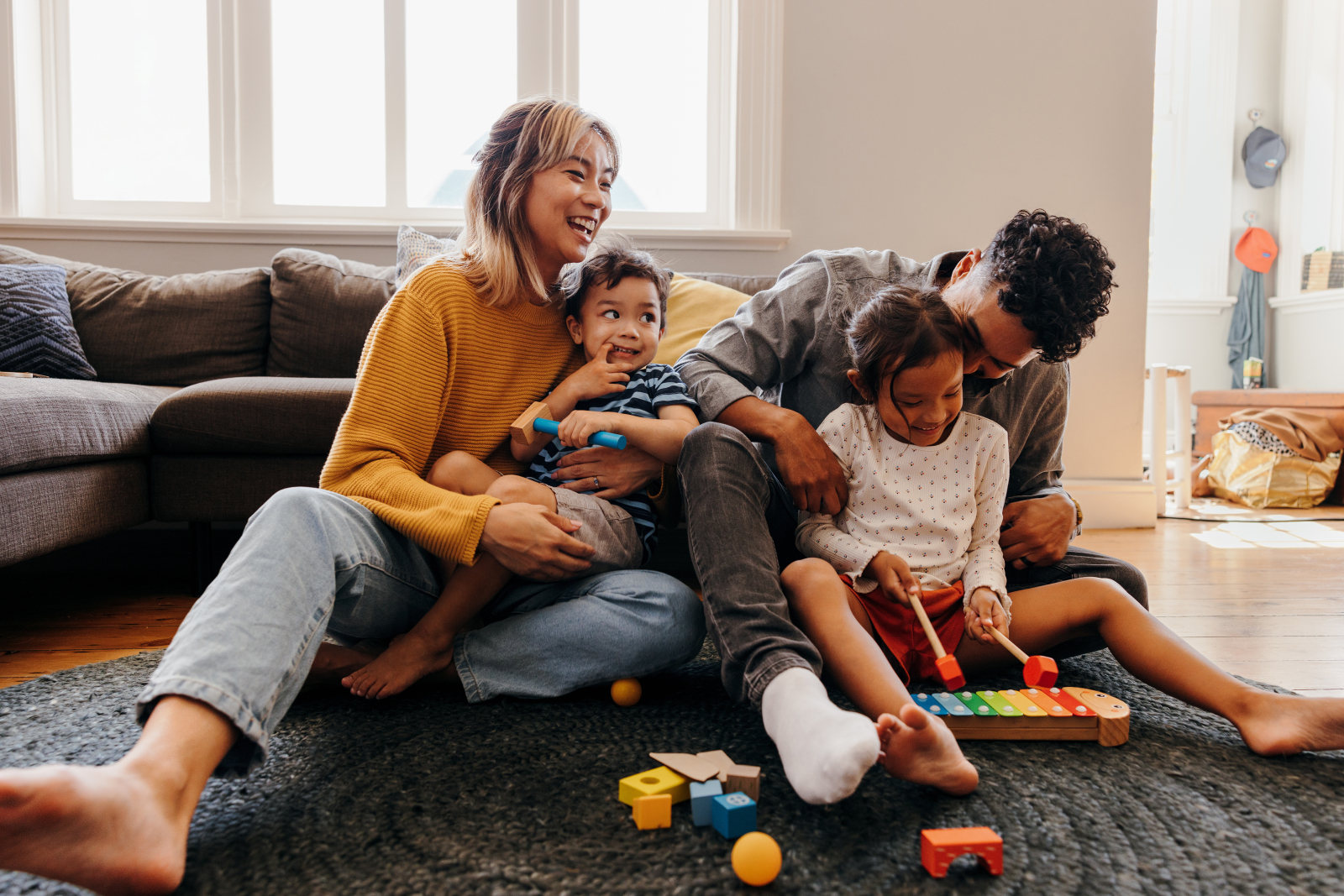 family playing together on the floor