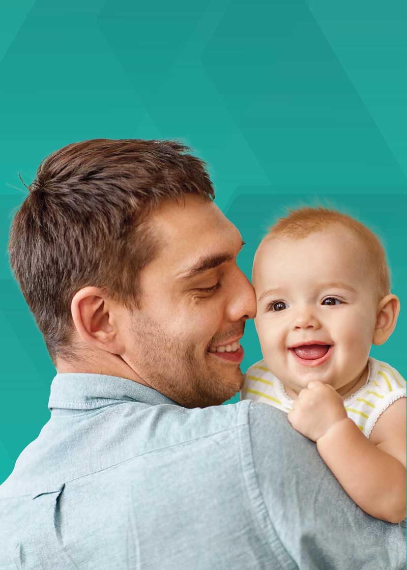 man holding smiling baby