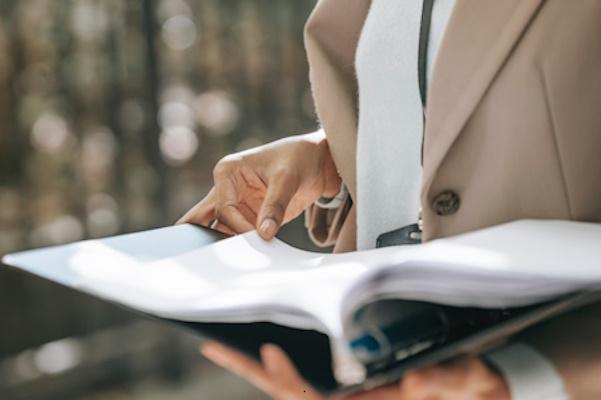 important documents person holding folder filled with important documents and information
